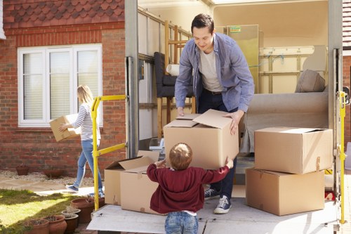 Professional packers preparing boxes for a move in Fulham